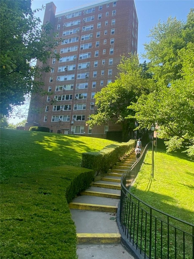 view of home's community with a lawn