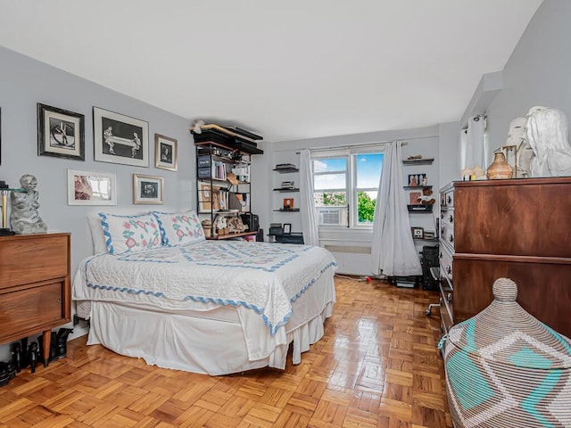 bedroom with light parquet floors