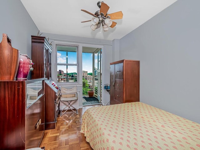 bedroom featuring ceiling fan and light parquet flooring