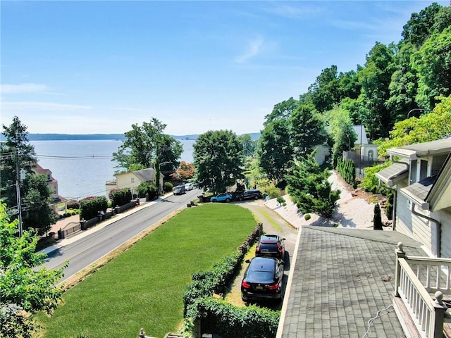 birds eye view of property with a water view