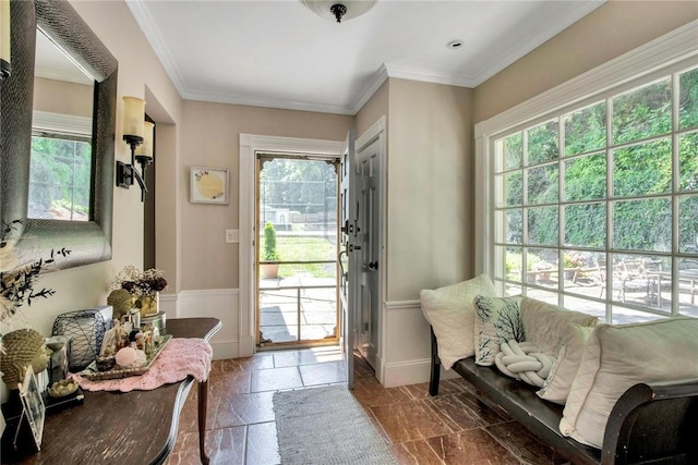 doorway to outside featuring ornamental molding and plenty of natural light