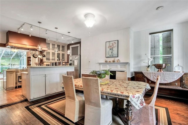 dining space with light hardwood / wood-style flooring