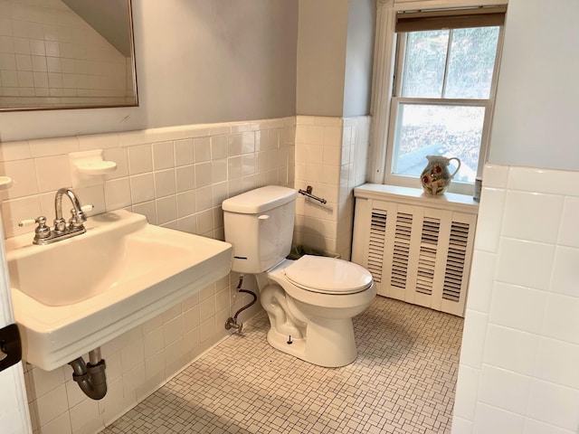 bathroom with tile patterned flooring and toilet