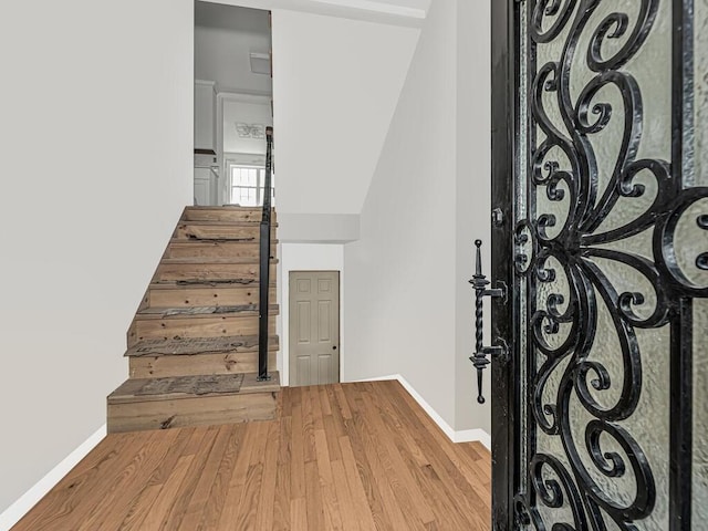 stairway featuring hardwood / wood-style floors