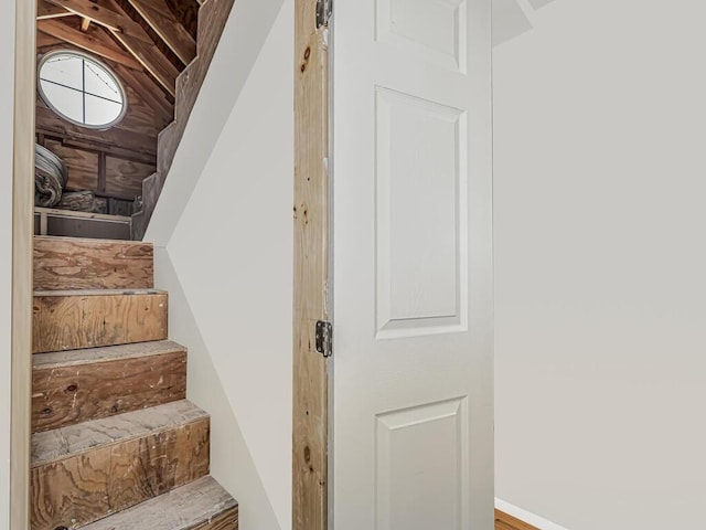 stairway with lofted ceiling