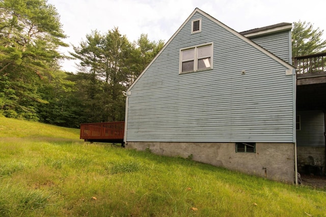 view of side of home with a deck