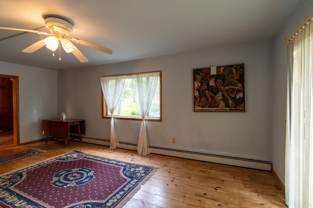 sitting room featuring ceiling fan and light wood-type flooring