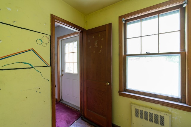 doorway to outside with radiator