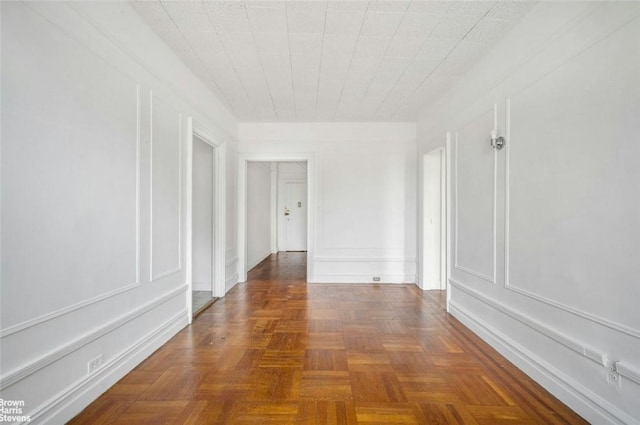 corridor with dark parquet flooring