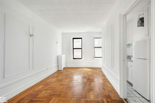 hallway with light parquet floors