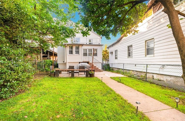 rear view of house with a lawn