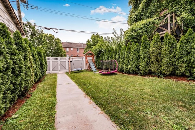 view of yard with a trampoline