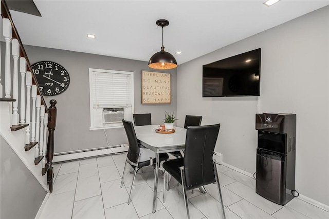 dining space featuring cooling unit and a baseboard radiator