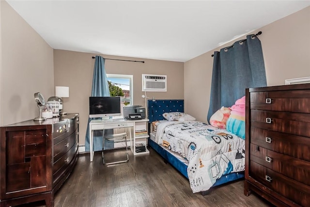 bedroom with a baseboard heating unit, a wall mounted AC, and dark wood-type flooring