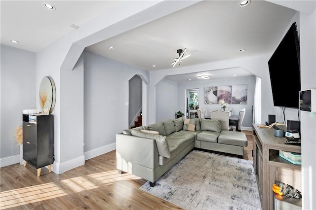 living room with light hardwood / wood-style floors