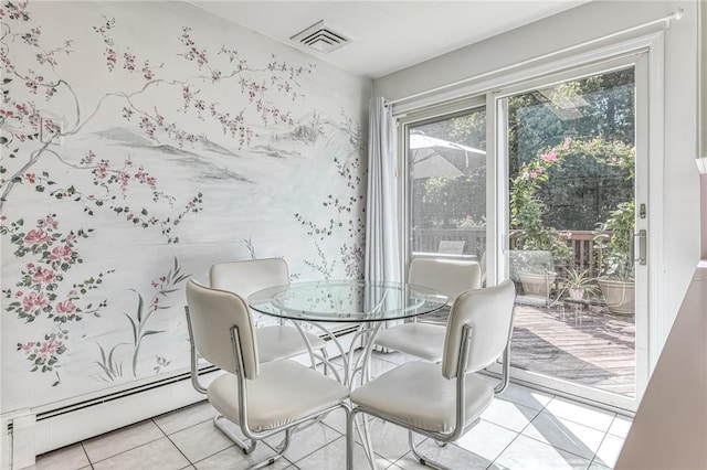 dining room with light tile patterned floors and a baseboard heating unit