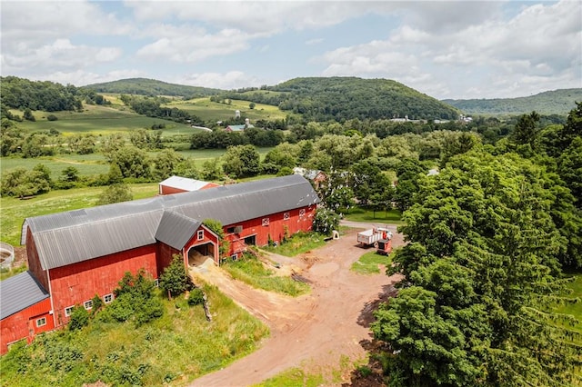 birds eye view of property with a mountain view