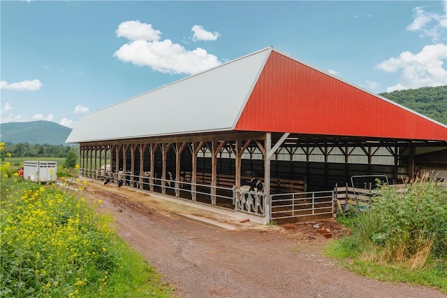 view of stable with a mountain view