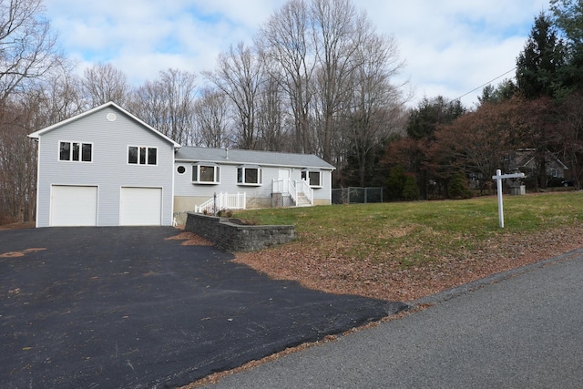 view of front facade with a front lawn and a garage