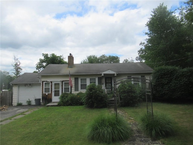 single story home with a garage and a front yard