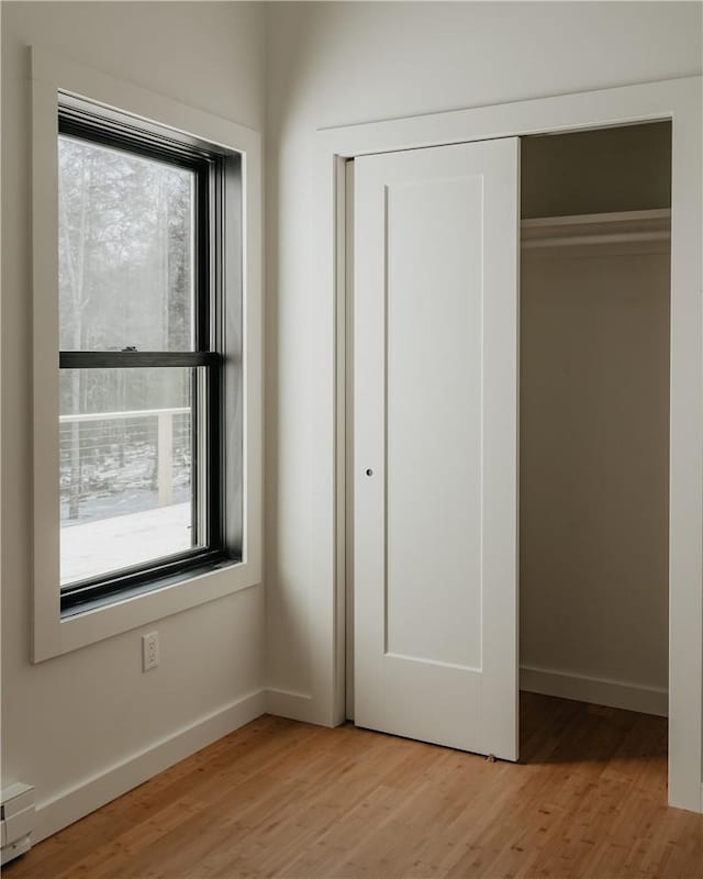 closet with a baseboard radiator