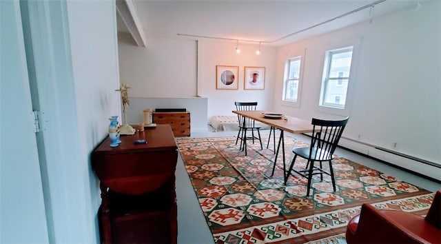 dining area featuring a baseboard heating unit