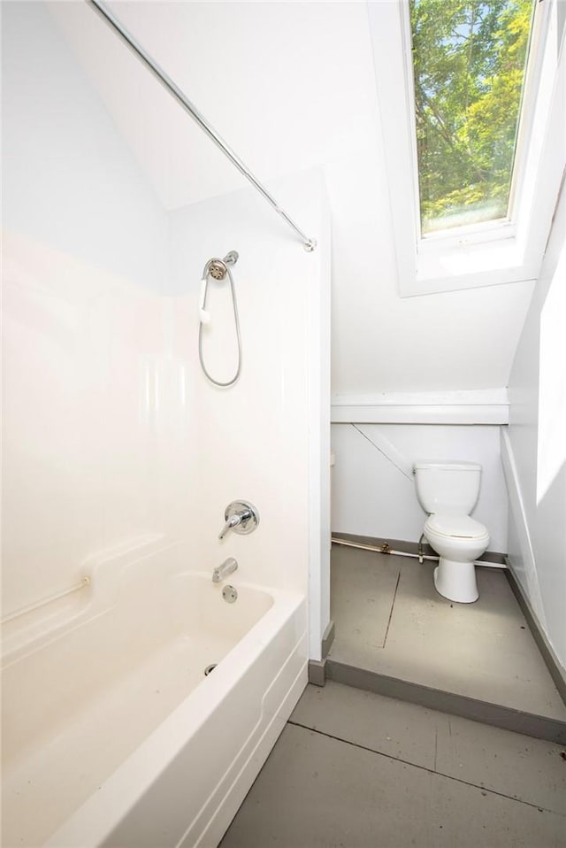 bathroom with shower / bathing tub combination and toilet