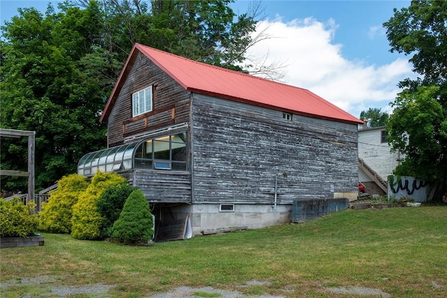 view of property exterior featuring a yard