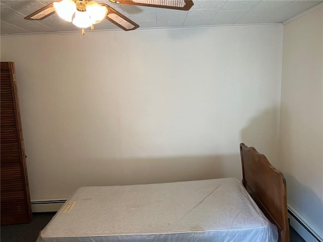 bedroom featuring baseboard heating, ceiling fan, and crown molding