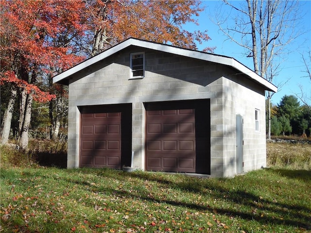 garage featuring a yard