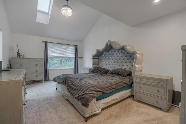 bedroom featuring light carpet and lofted ceiling with skylight