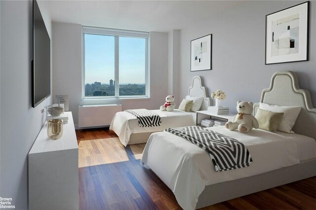 640 W 237th St Unit 20B, Bronx, NY 10463 - bedroom featuring radiator and wood finished floors