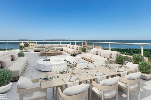 view of patio / terrace with an outdoor living space and a water view