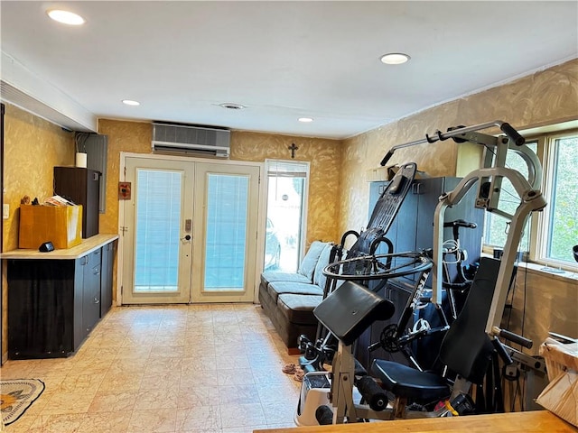 workout area featuring french doors and a wall mounted AC