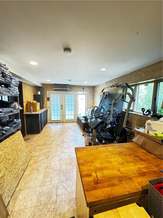 interior space featuring a wall mounted air conditioner and french doors