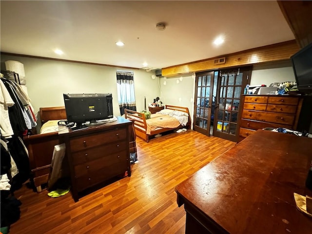 bedroom with hardwood / wood-style floors