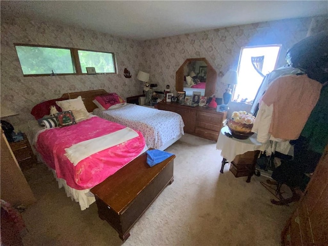 bedroom with multiple windows and carpet