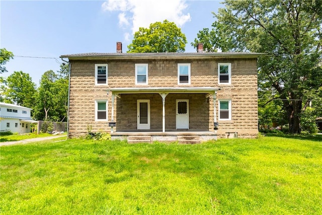 view of front of house featuring a porch and a front yard