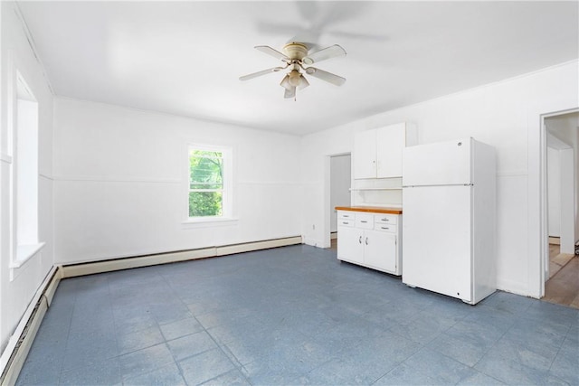 interior space with a baseboard radiator and ceiling fan