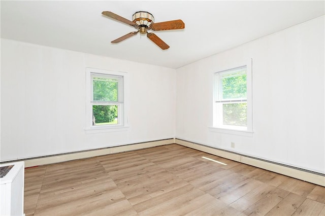 spare room featuring light wood-type flooring and ceiling fan