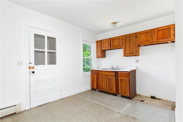 kitchen with sink and baseboard heating