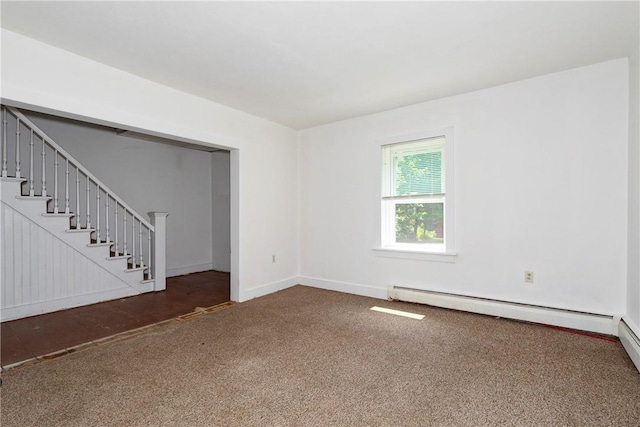 carpeted empty room featuring a baseboard radiator