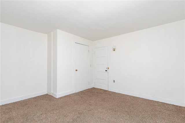 empty room featuring carpet floors