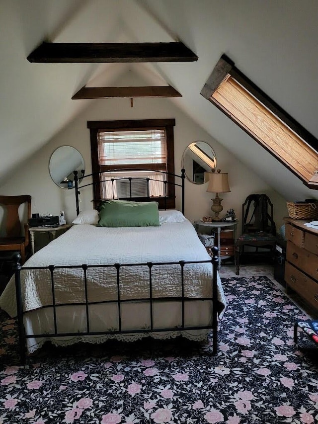 bedroom with lofted ceiling with skylight and dark carpet