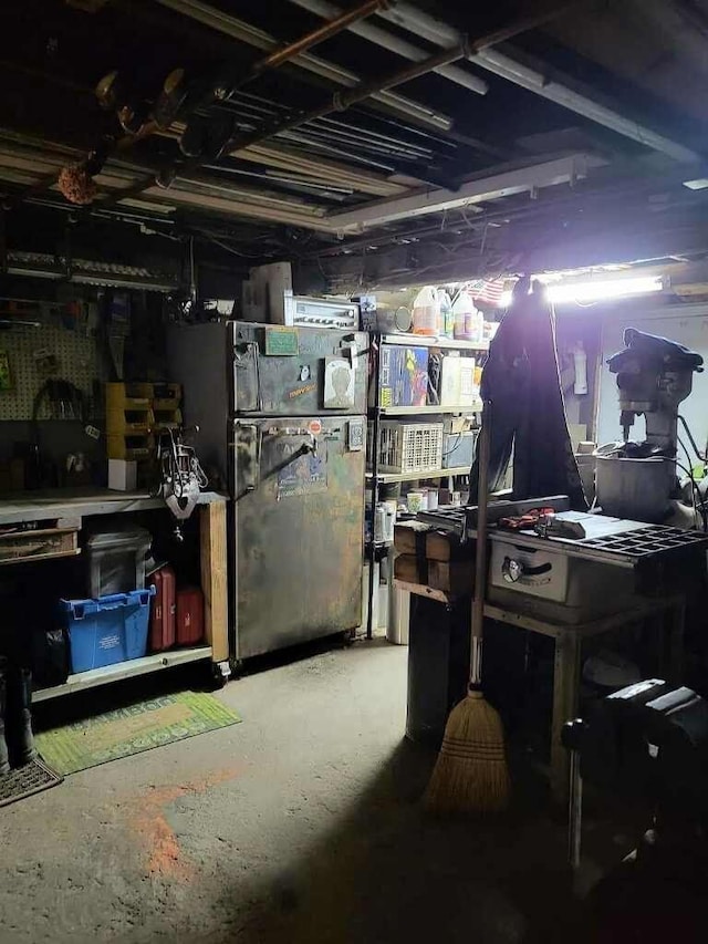 basement with black fridge