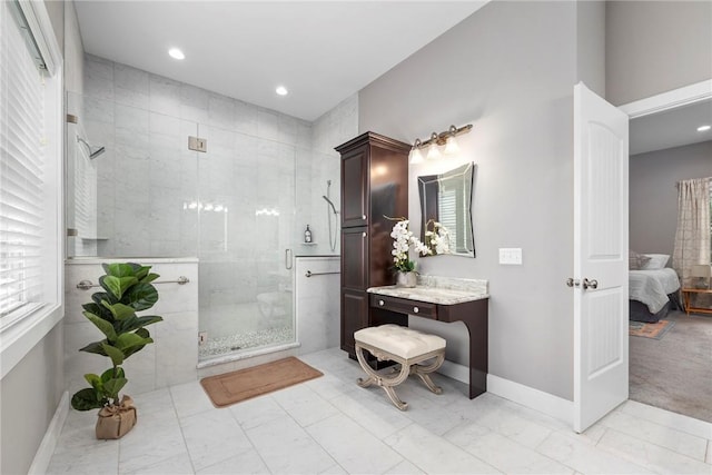 bathroom with vanity and walk in shower