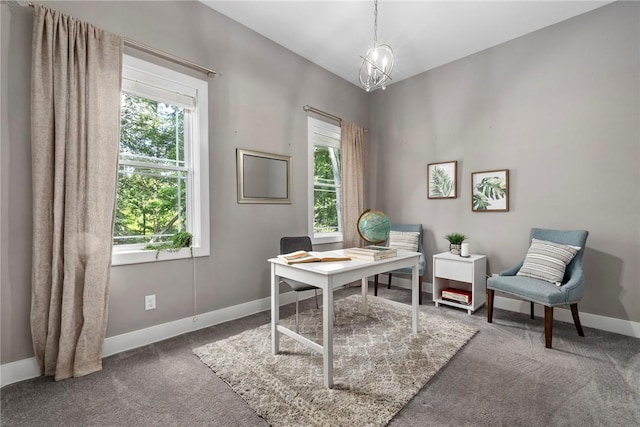 carpeted home office featuring plenty of natural light and a notable chandelier