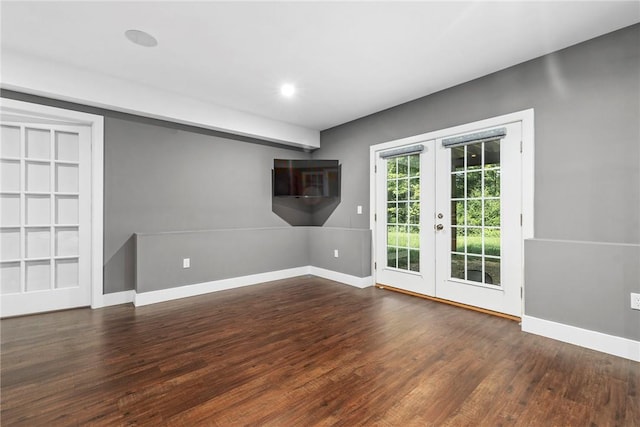 empty room with french doors and dark hardwood / wood-style floors