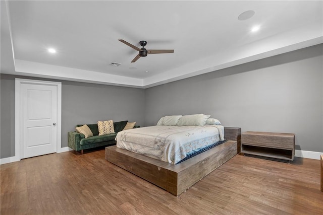 bedroom featuring hardwood / wood-style floors and ceiling fan