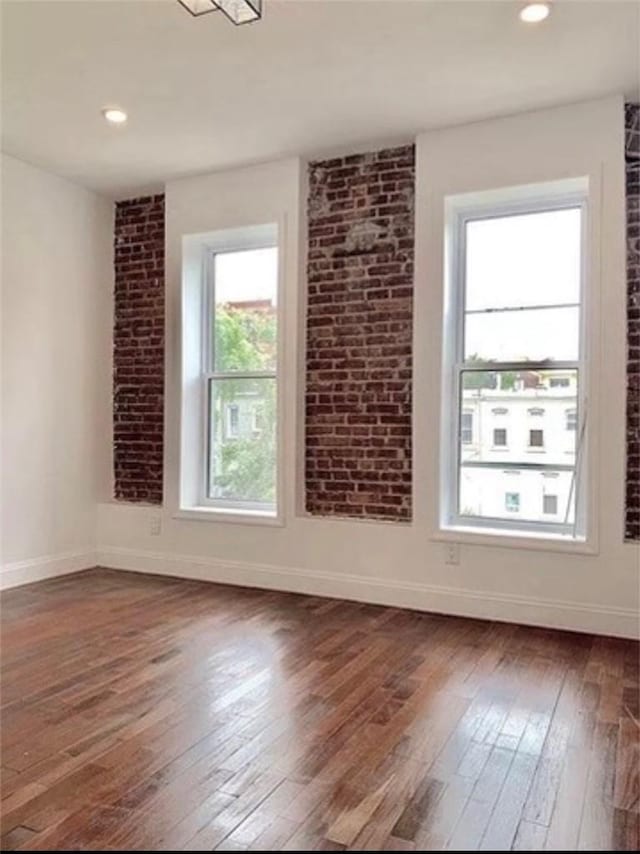 empty room with dark wood-type flooring